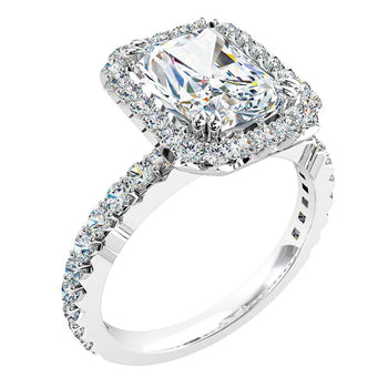 a white gold radiant cut diamond cluster halo engagement ring with diamonds on the band