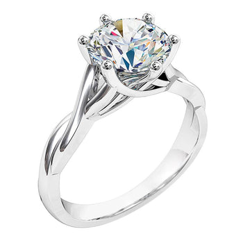 A platinum or white gold round brilliant cut diamond solitaire twist band engagement ring