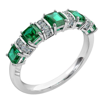 A platinum or white gold women's diamond wedding ring featuring sapphire gemstones