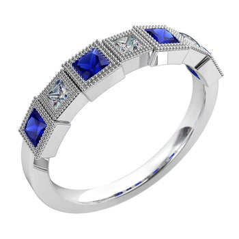 A platinum or white gold women's diamond wedding ring with blue sapphire gemstones