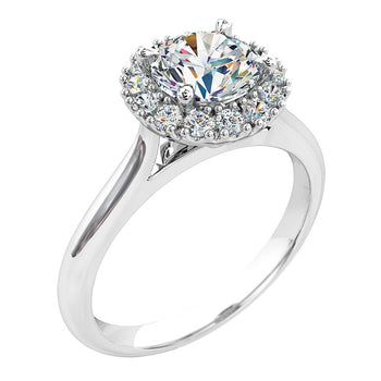 A platinum or white gold round brilliant cut diamond cluster halo solitaire engagement ring