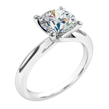A platinum or white gold round brilliant cut diamond four-claw solitaire engagement ring melbourne