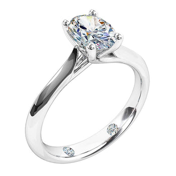A platinum or white gold oval cut diamond solitaire engagement ring with two round brilliant cut diamonds hammered on the inside of the band