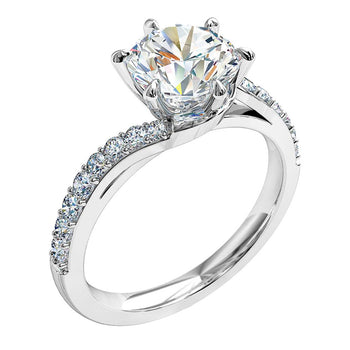 A platinum or white gold round brilliant cut diamond solitaire engagement ring with diamonds on a twist band