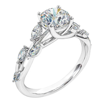 A platinum or white gold round brilliant cut solitaire engagement ring with marquise side diamonds