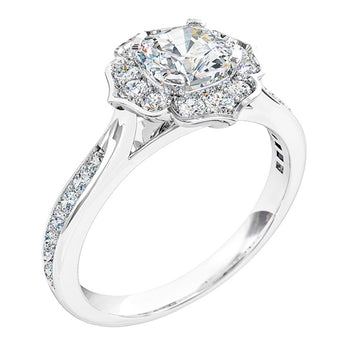 A platinum or white gold cushion cut diamond cluster halo engagement ring with a grain set diamond band