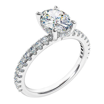 A platinum or white gold oval cut diamond solitaire engagement ring with diamonds on the band and a diamond hidden halo