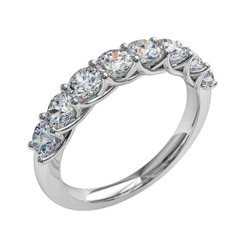 A platinum or white gold women's signature diamond wedding ring featuring round brilliant cut diamonds
