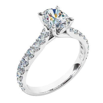 A platinum or white gold oval brilliant cut diamond solitaire engagement ring with a shared claw diamond band