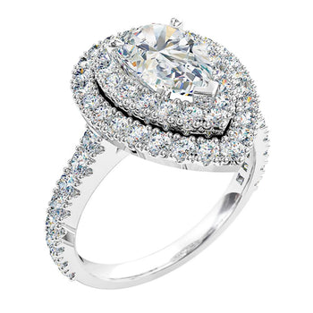 A white gold pear cut diamond engagement ring with a double halo and side diamonds