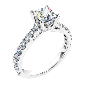 A platinum or white gold princess cut diamond solitaire engagement ring with diamonds on the band in a shared claw setting
