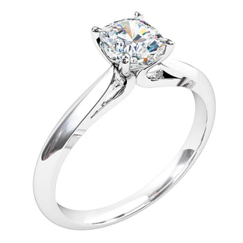 A platinum or white gold cushion cut diamond solitaire engagement ring