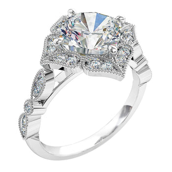 A platinum or white gold cushion cut diamond cluster halo engagement ring with diamonds on the band 