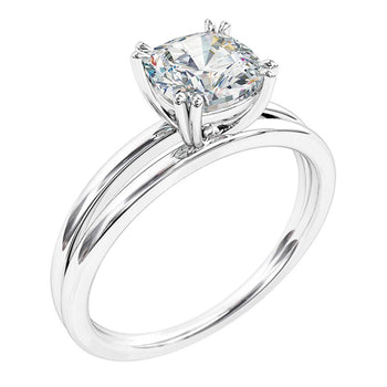 A platinum or white gold double claw cushion cut diamond solitaire split band engagement ring