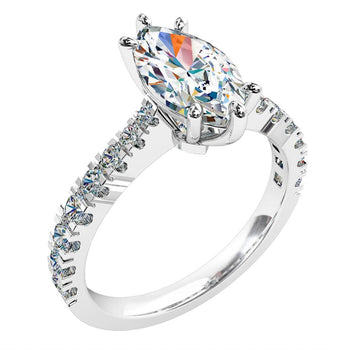 A platinum or white gold marquise cut diamond solitaire engagement ring with diamonds on the band