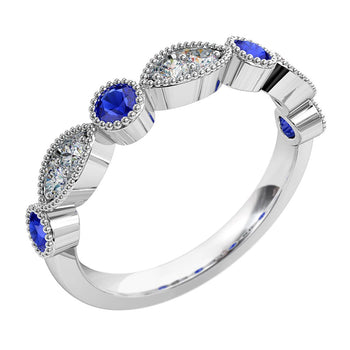 A platinum or white gold women's diamond wedding ring featuring blue sapphire gemstones with a milgrain setting