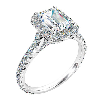 A platinum or white gold emerald cut diamond cluster halo engagement ring with diamonds on the band in an individual claw setting