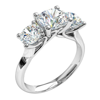 A platinum or white gold round brilliant cut diamond solitaire trilogy engagement ring with two round brilliant cut diamonds