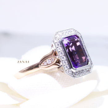 A 9ct rose and white gold emerald-shaped amethyst cluster halo dress ring featuring round brilliant cut diamonds