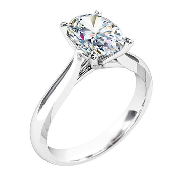 A platinum or white gold oval cut diamond solitaire engagement ring