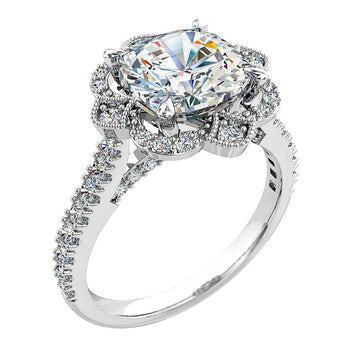 A platinum or white gold cushion cut diamond cluster halo engagement ring with diamonds on the band and under the bridge