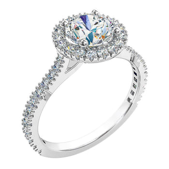 A platinum or white gold round brilliant cut diamond cluster halo engagement ring with diamonds on the band
