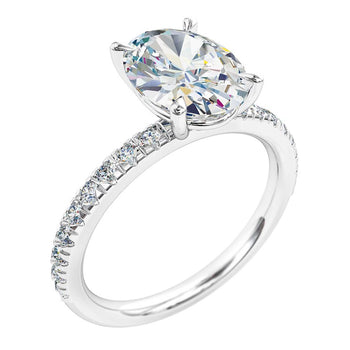 A platinum or white gold oval brilliant cut diamond solitaire engagement ring complimented by an individual claw set diamond band