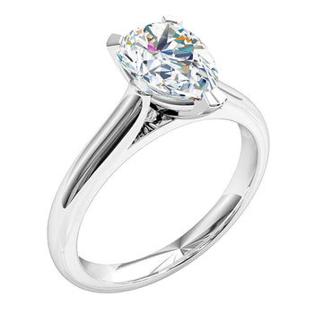 A platinum or white gold pear shape diamond solitaire engagement ring