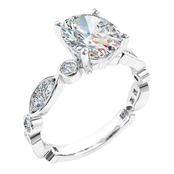 A platinum or white gold oval cut diamond solitaire engagement ring with a bezel and grain set diamond band