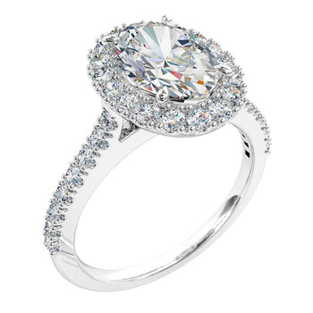 A platinum or white gold oval cut diamond cluster halo engagement ring complimented with a diamond band