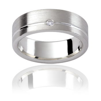 A platinum or white gold men's classic wedding ring with an off-centred groove. Complimented with a round brilliant cut diamond hammered into the band.