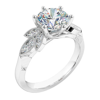 A platinum or white gold round brilliant cut diamond six-claw solitaire engagement ring. Complimented with diamonds on the band in a petal design with milgrain finish.