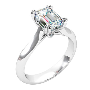 A platinum or white gold emerald cut diamond solitaire engagement ring