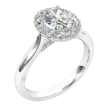 A platinum or white gold oval cut diamond cluster halo solitaire engagement ring. Complimented with diamonds under the bridge.