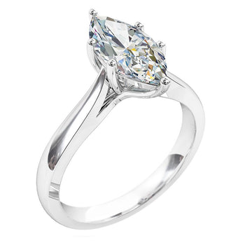 A platinum or white gold marquise cut diamond six-claw solitaire engagement ring