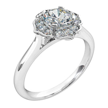 A platinum or white gold cushion cut diamond halo solitaire engagement ring
