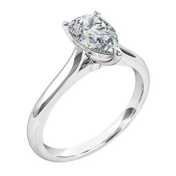 A platinum or white gold pear cut diamond solitaire engagement ring