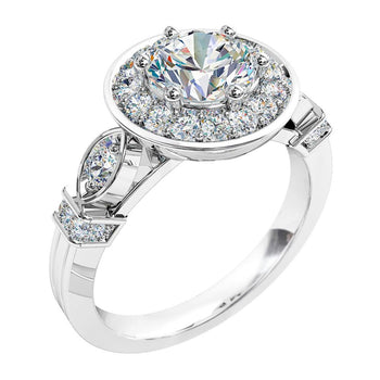 A platinum or white gold round brilliant cut diamond vintage halo engagement ring