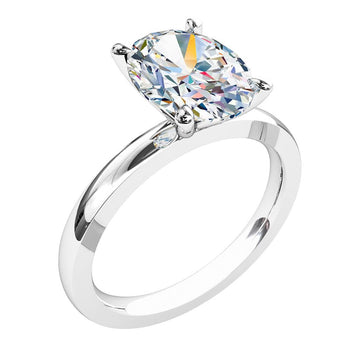 A platinum or white gold oval brilliant cut diamond solitaire engagement ring